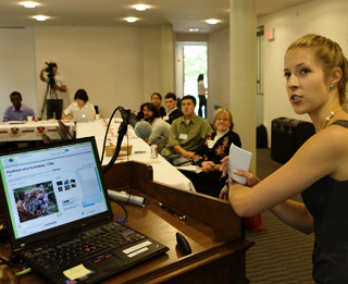 student presenting with laptop