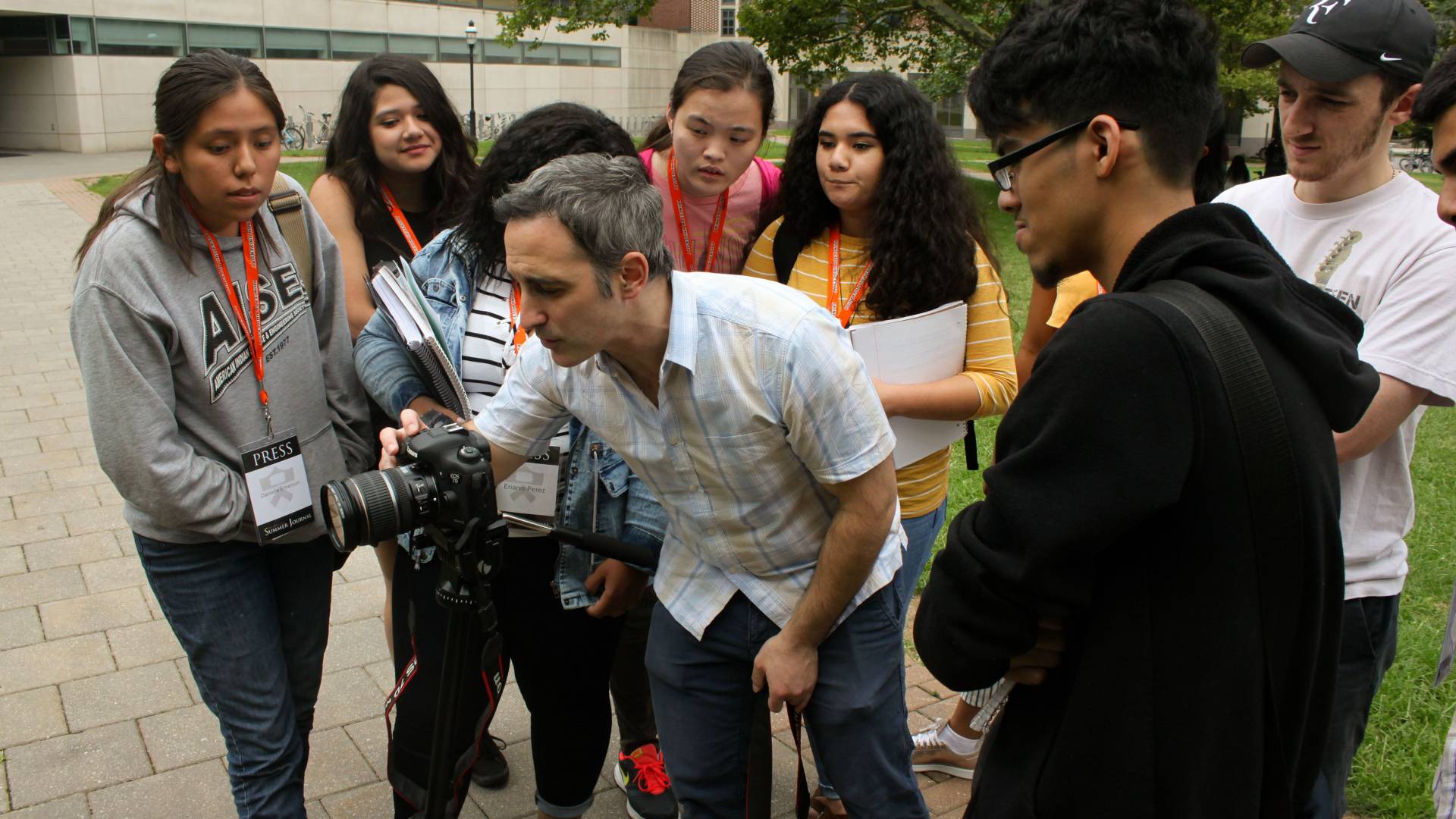 Students filming video with counselor