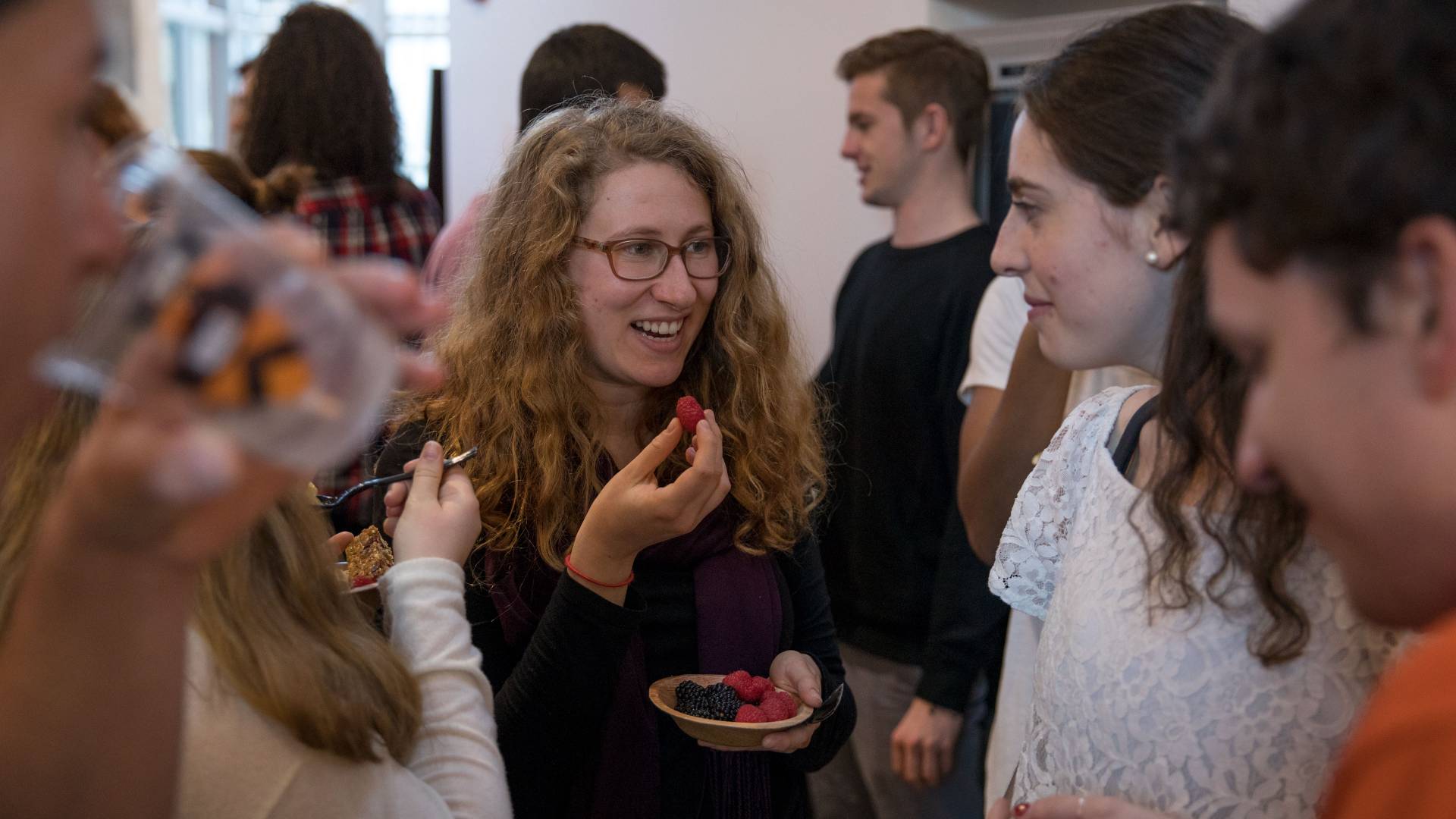 Students talking and eating berries