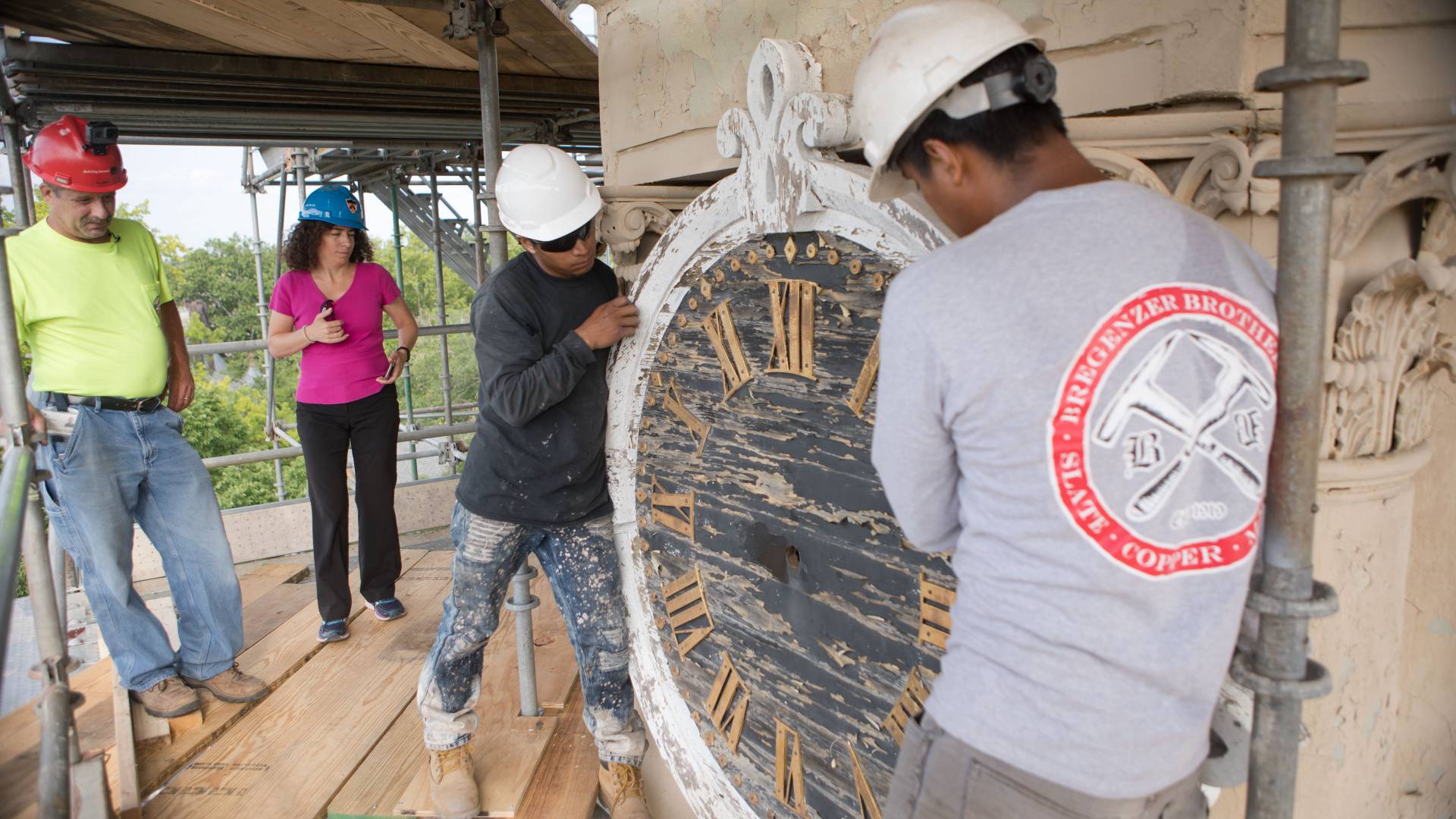 Workers removing old clock from Nassau Hall cupola