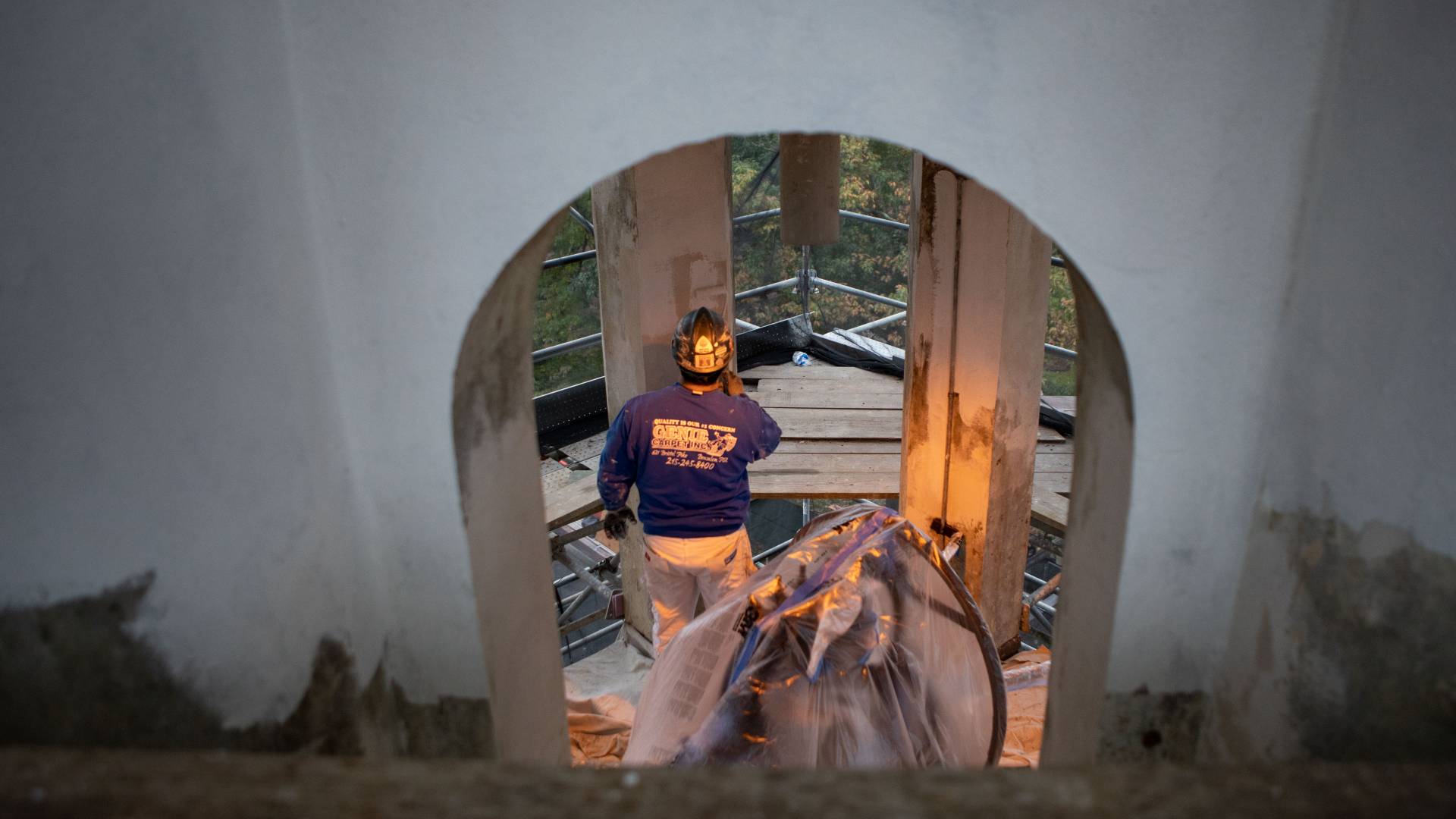 Worker painting interior of Nassau Hall cupola