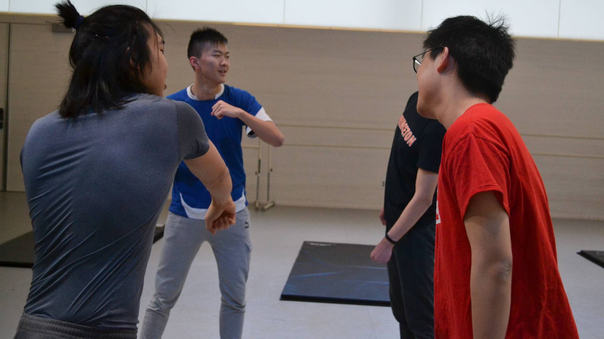 Students practicing unarmed stage combat during wintersession