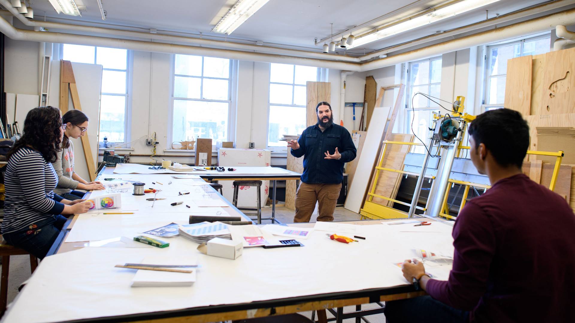 Orlando Murgado instructing students during wintersession class on sculpture