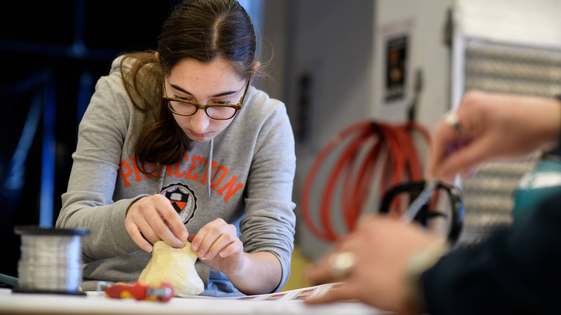 Student working on sculpture during wintersession class