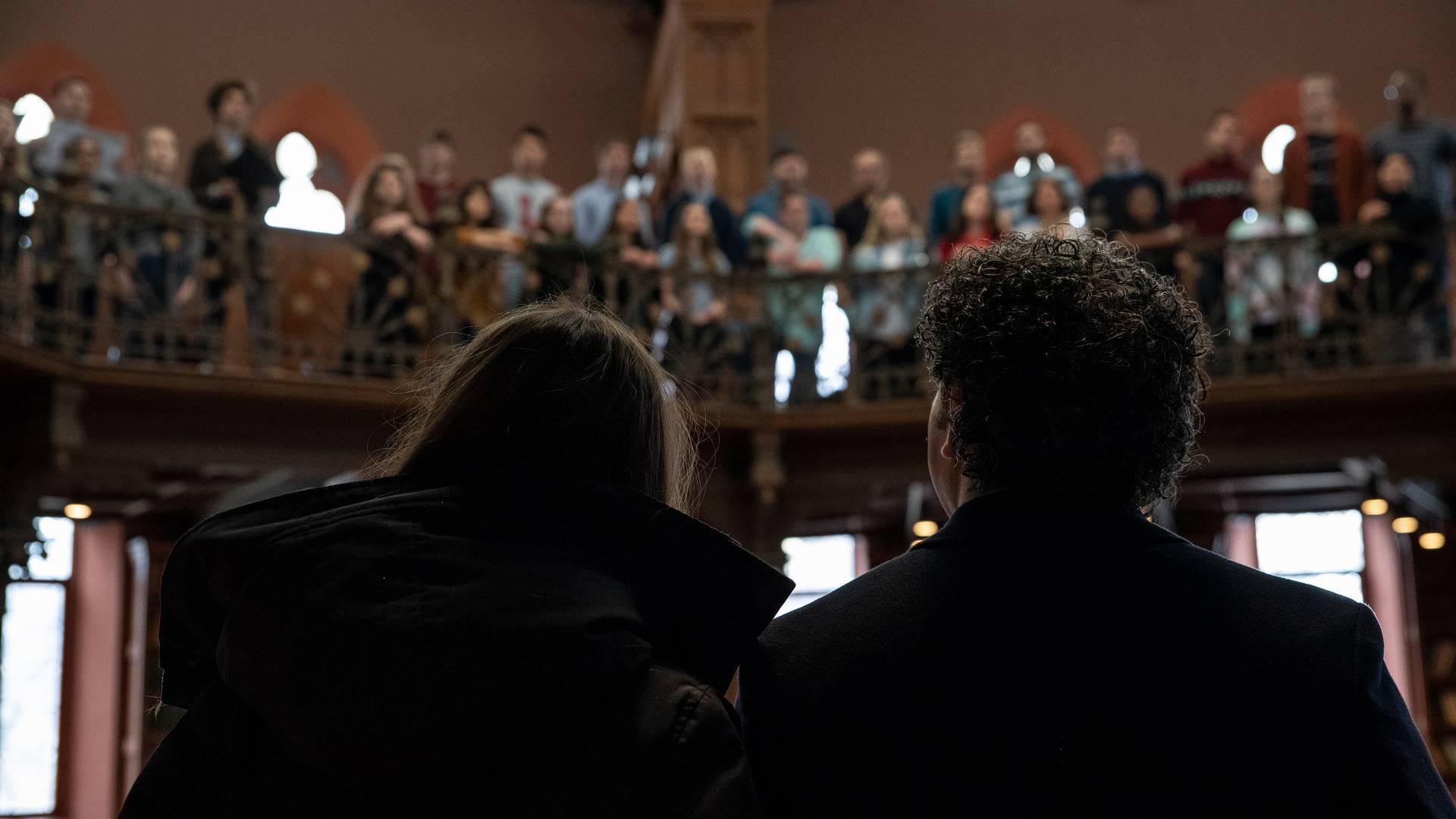 Gustavo Dudamel and his wife looking up to balcony
