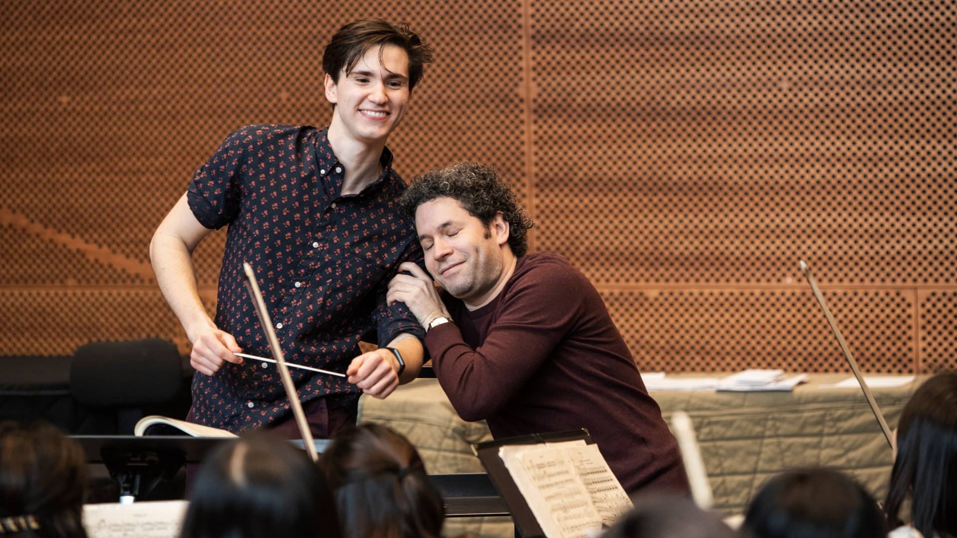 Gustavo Dudamel hugging Reilly Bova