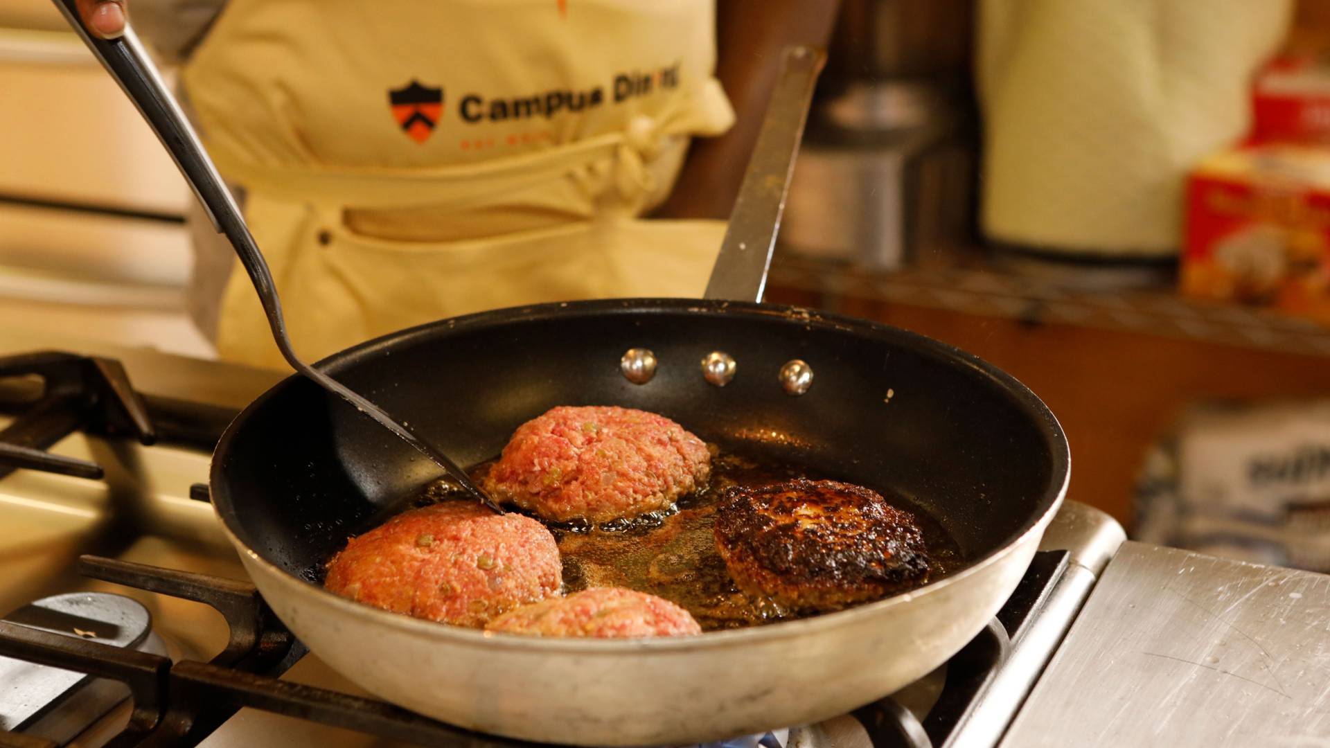 Pan with meat cooking in it