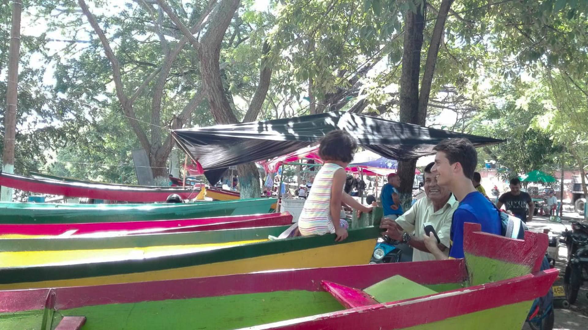 Jordan Salama standing by boats