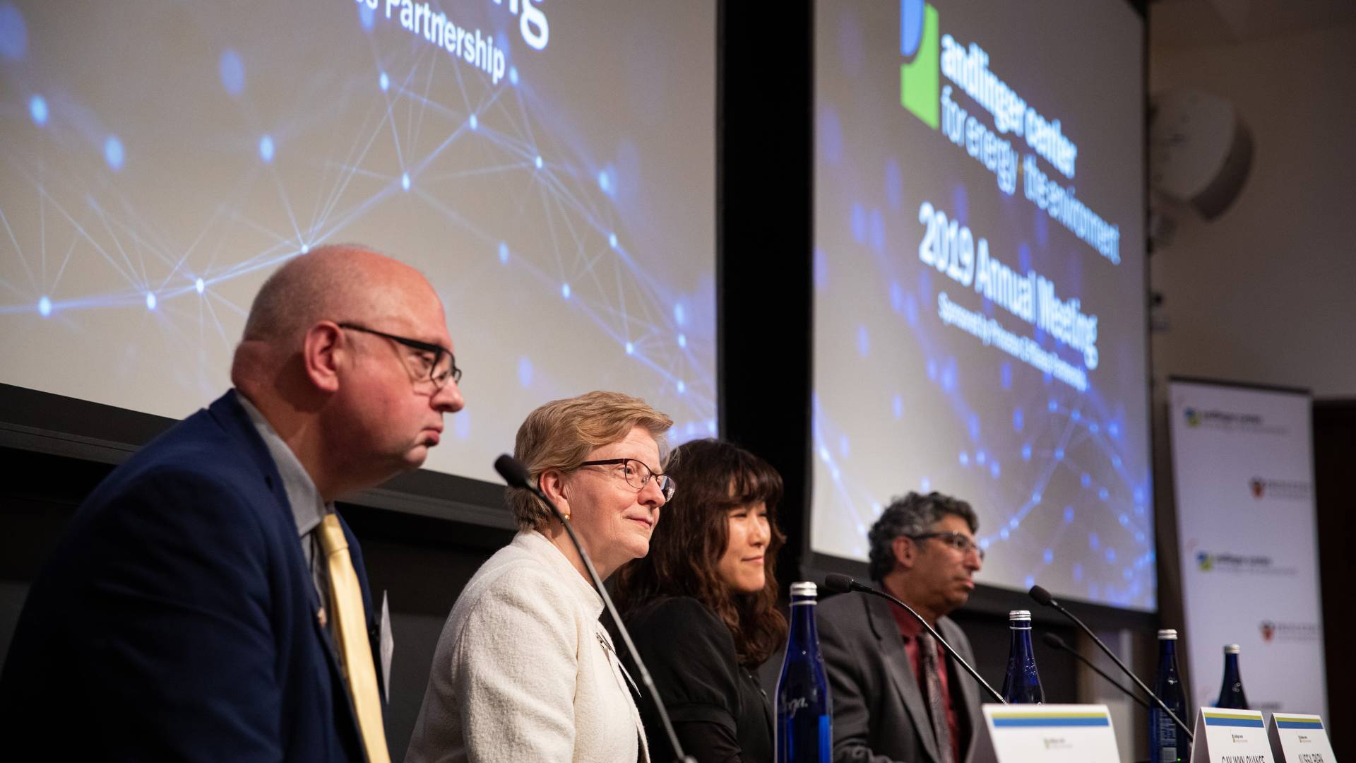 4 people sit at a table