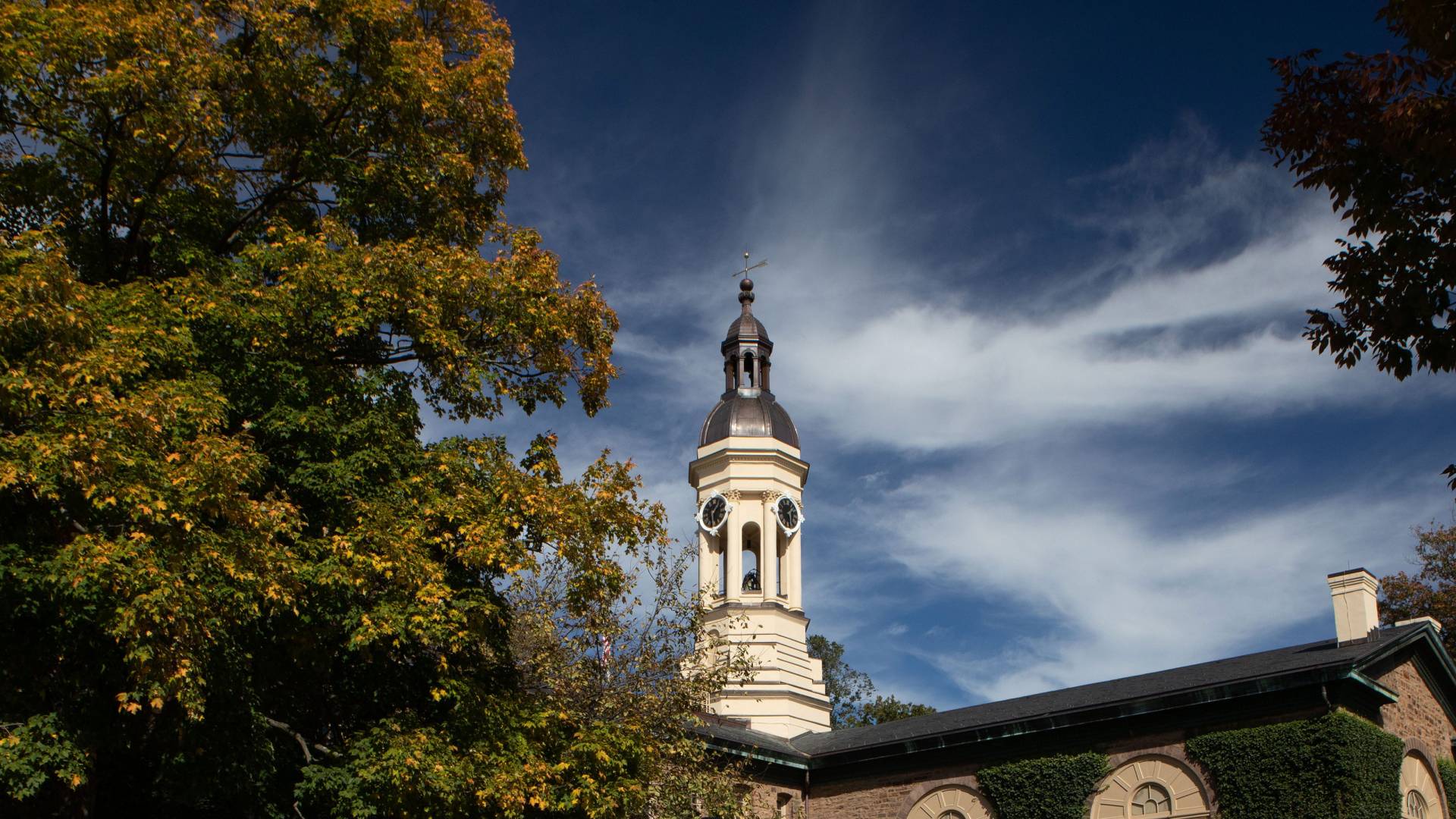 Nassau Hall  with white clouds and blue sky behind
