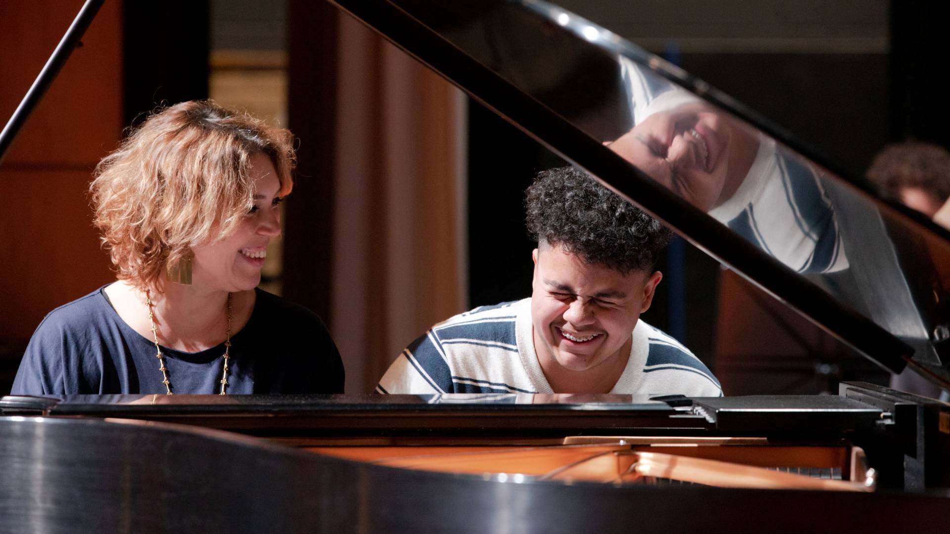 Montero shares a laugh with  student