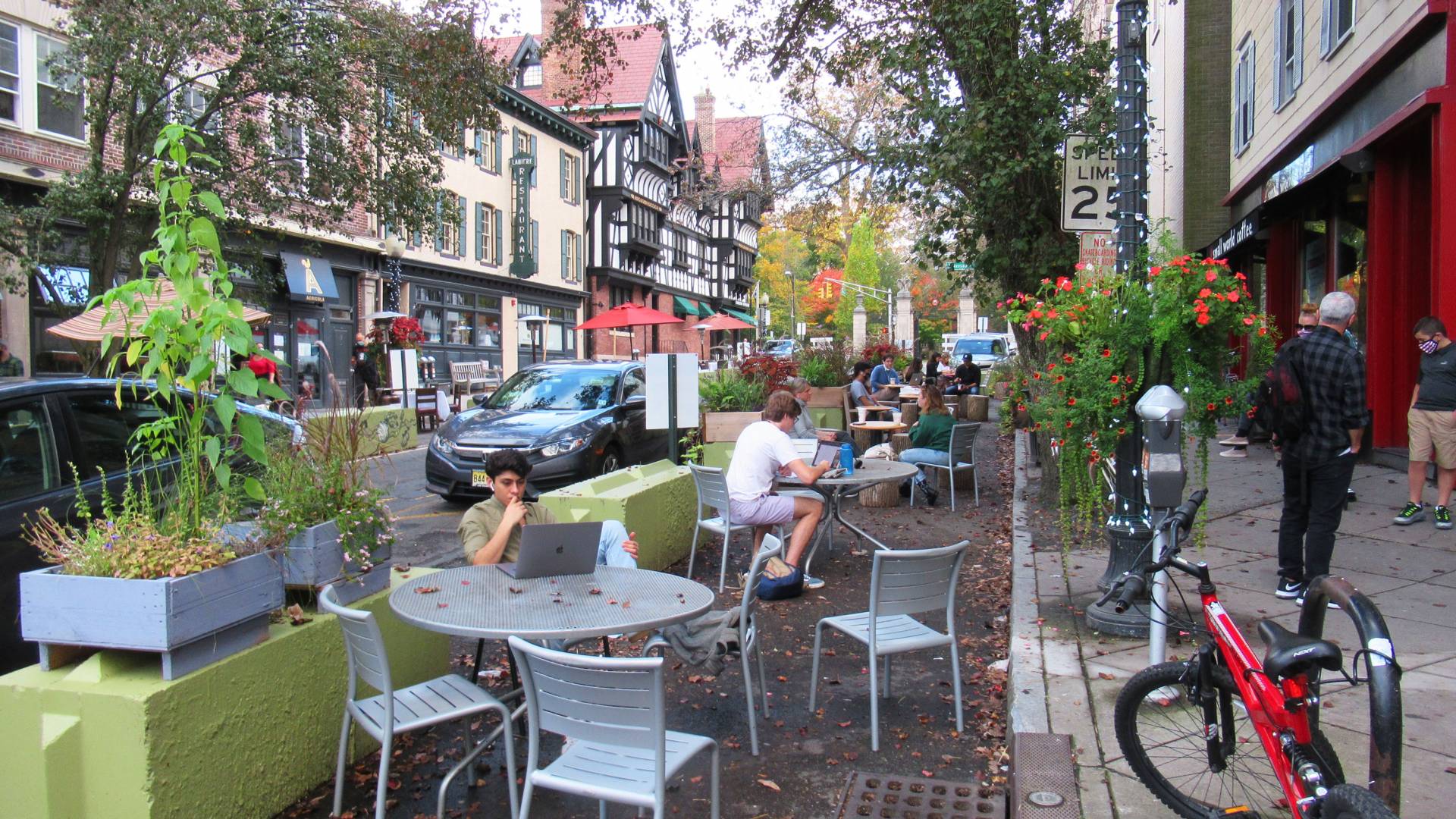 People sit at tables on Witherspoon street