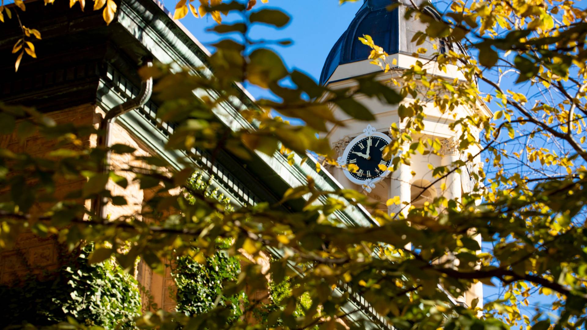 Nassau Hall clock tower in fall