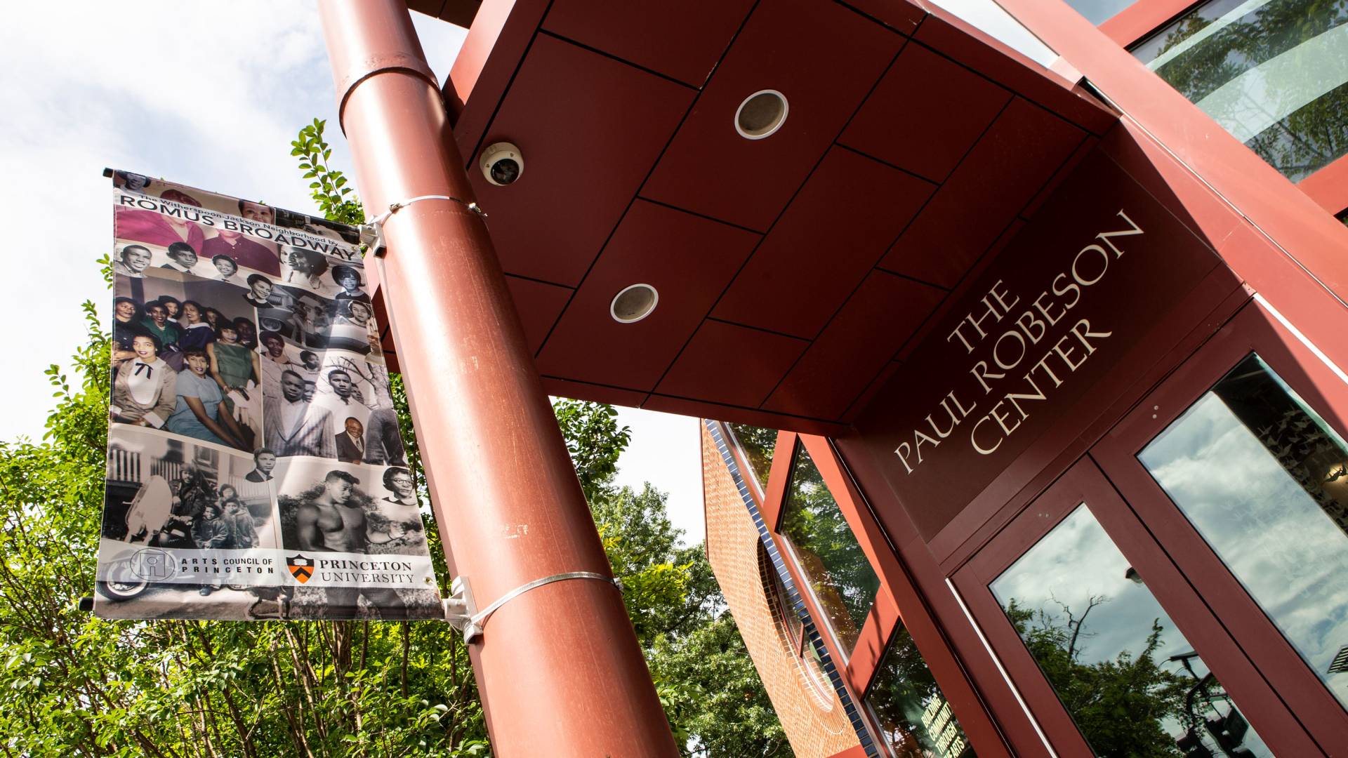 a banner advetising the Romus Broadway exhibit outside the Paul Robeson Center