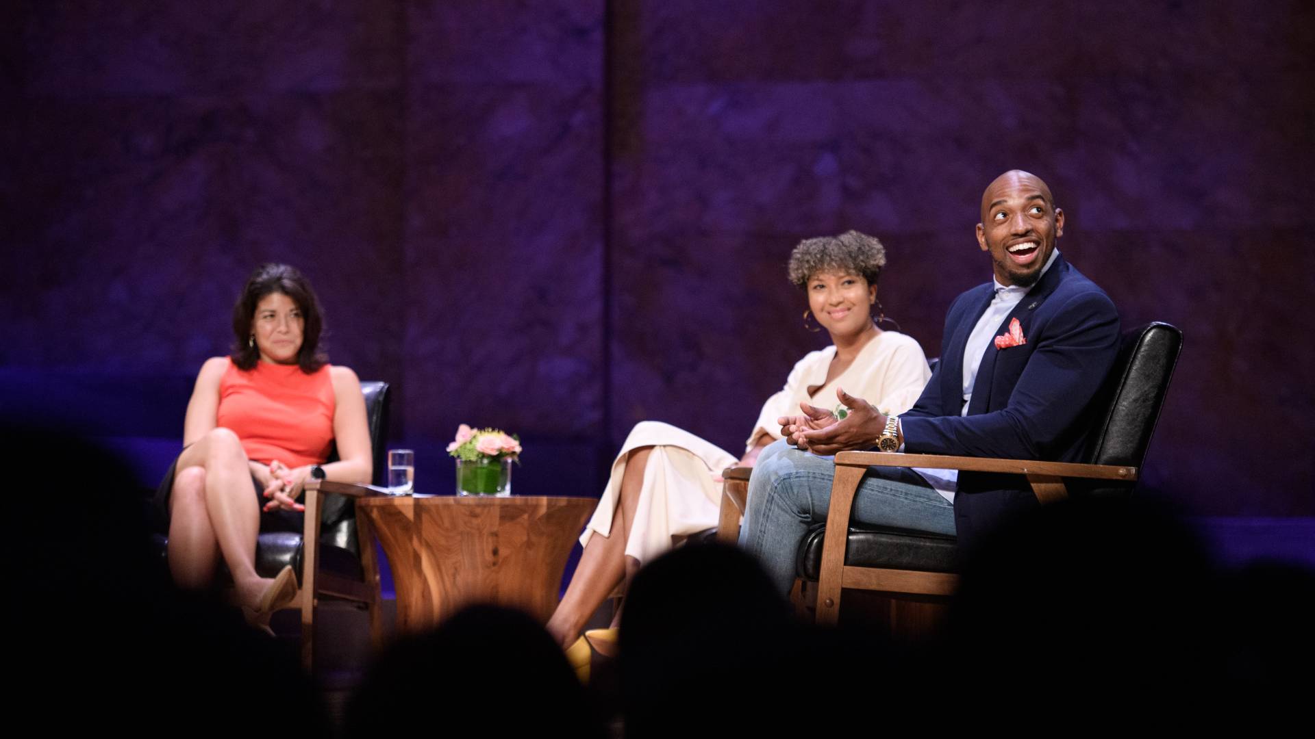 Alumni discuss their career paths on stage.