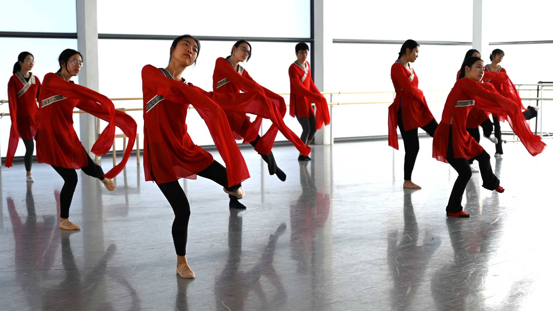 women dancing with flowing sleeves