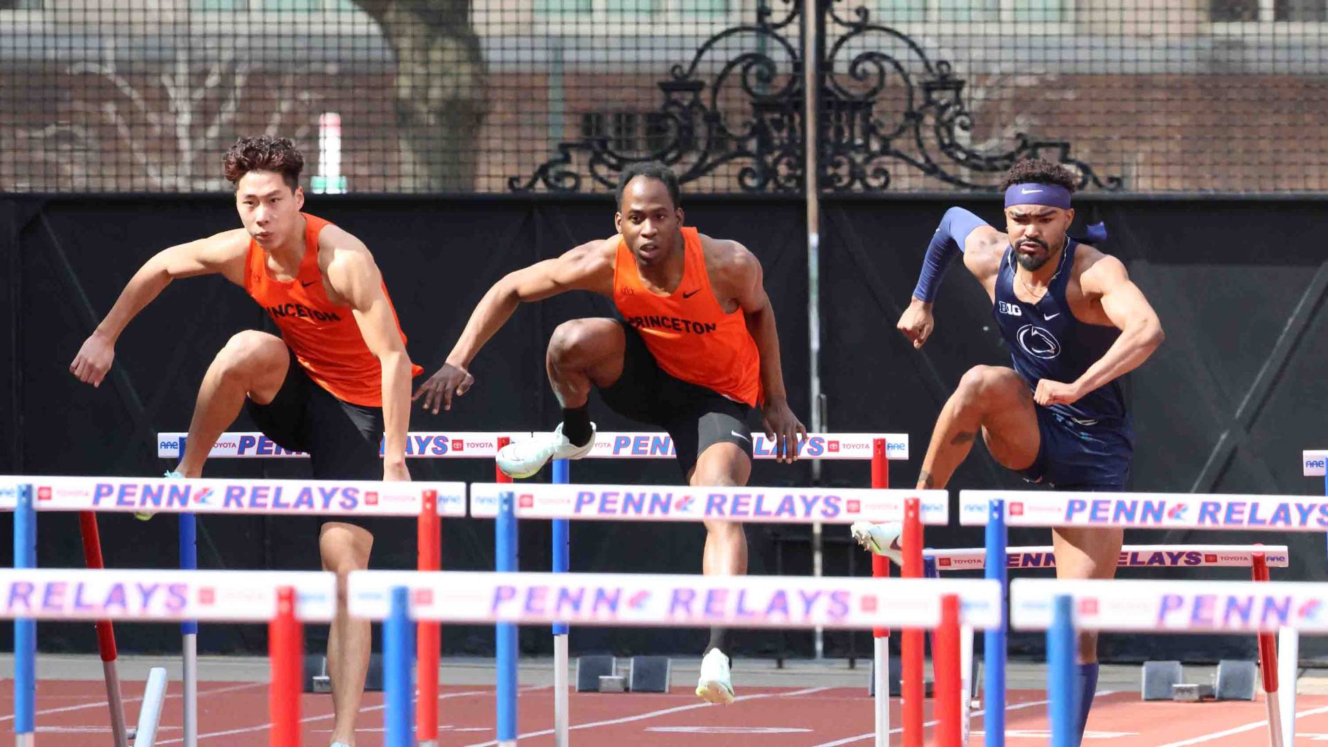 Jovan jumping over hurdles.
