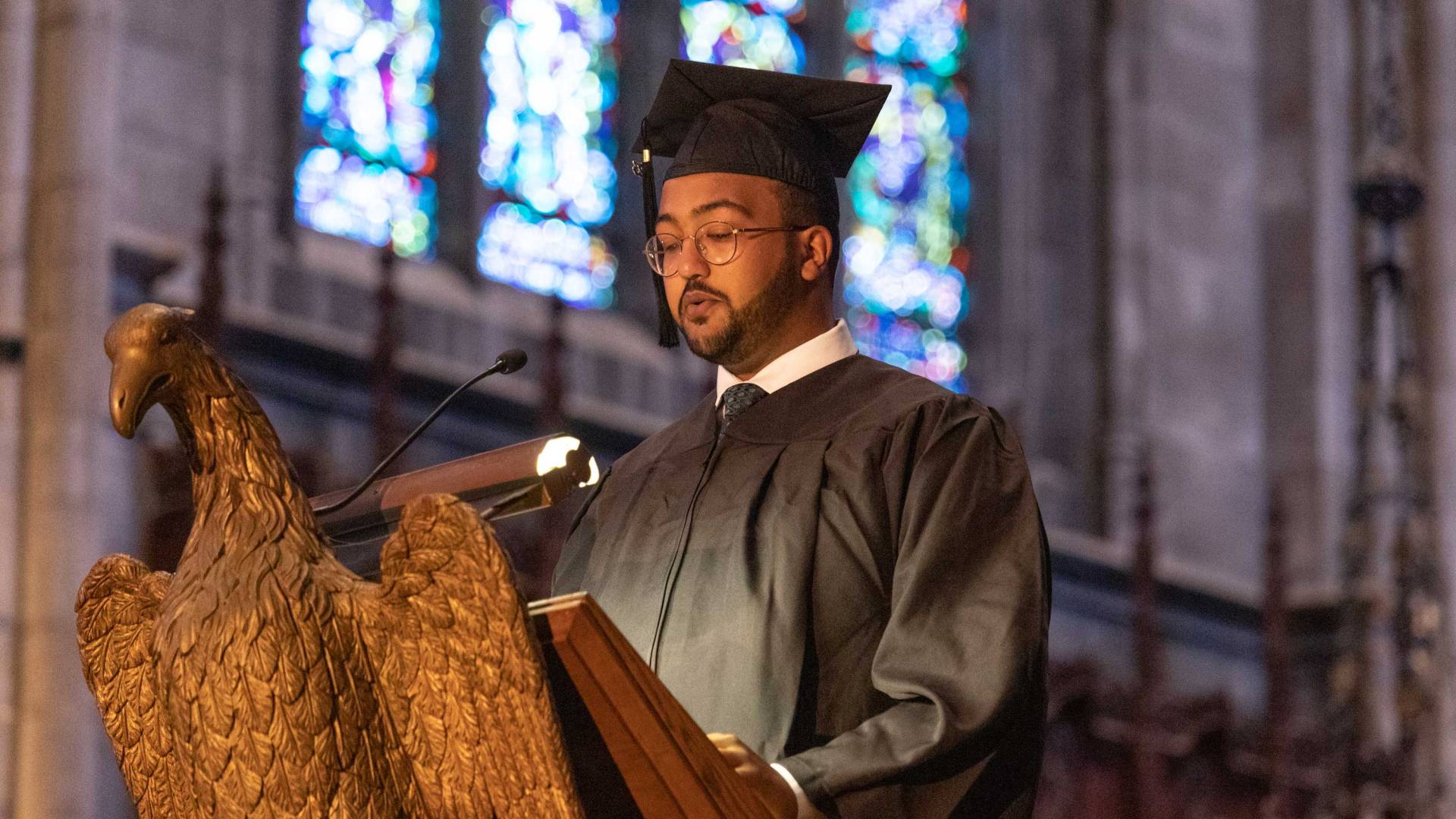 a student reads at the podium