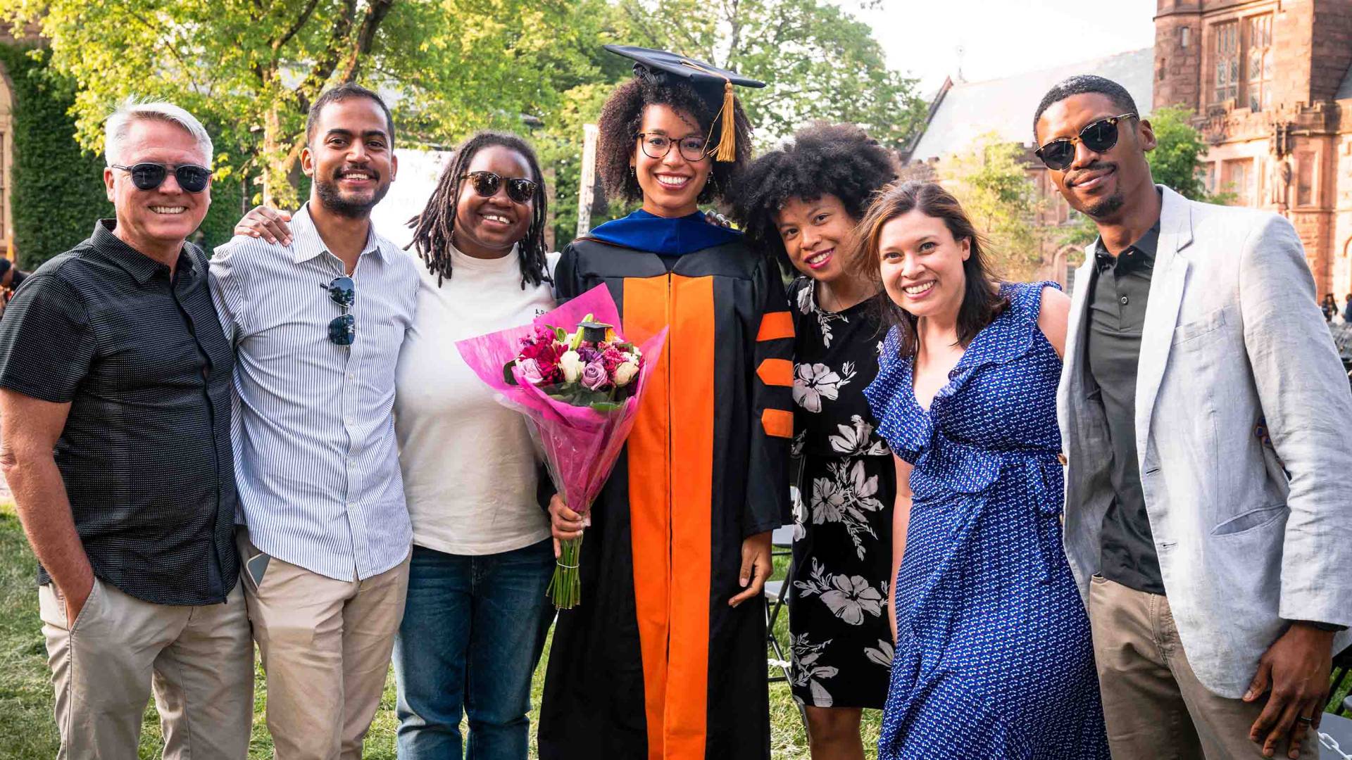 Graduate students smiling with their family