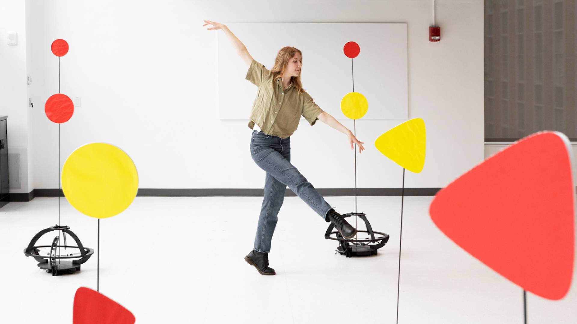 Sarah Witzman dancing amongst robots