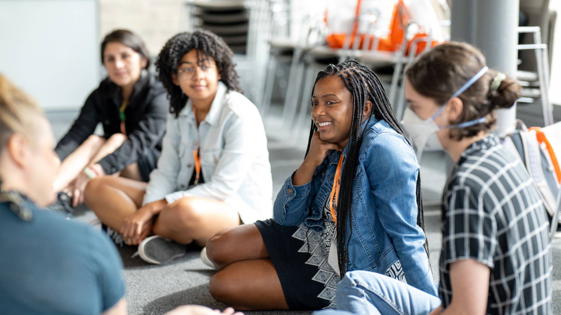 People sitting on the floor in a circle