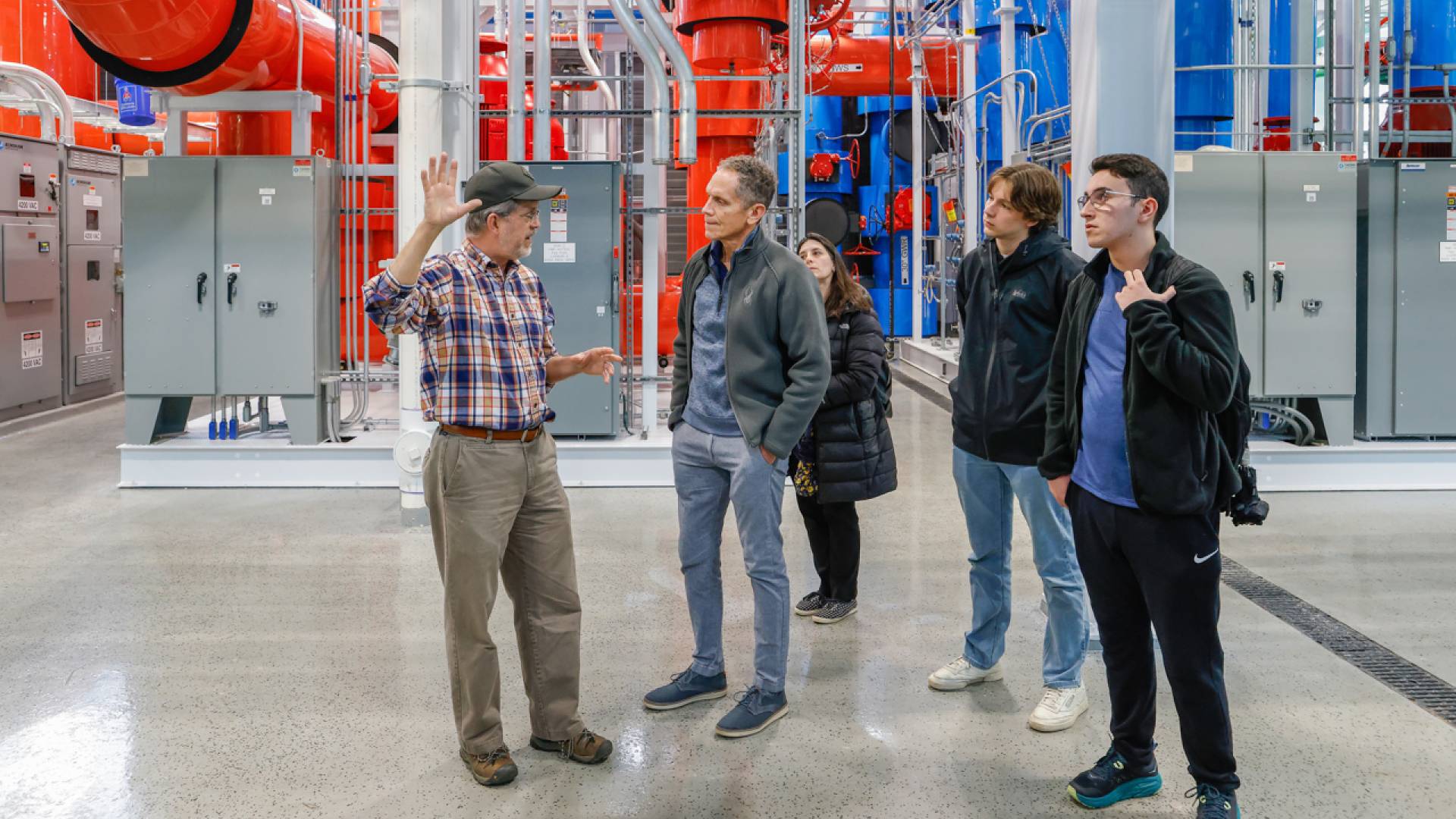 Ted Borer (left), director of the energy plant, leads a tour of the TIGER facility, which was recently featured in a New York Times story about the University's geo-exchange energy system.&nbsp;