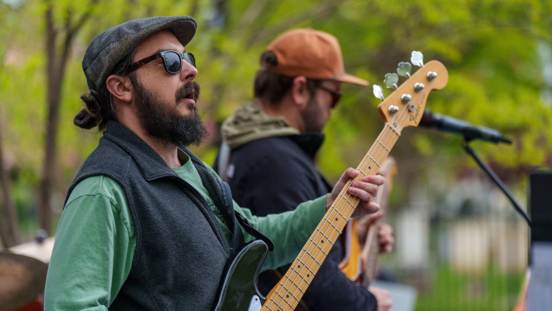 Bassist with glasses playing the bass.