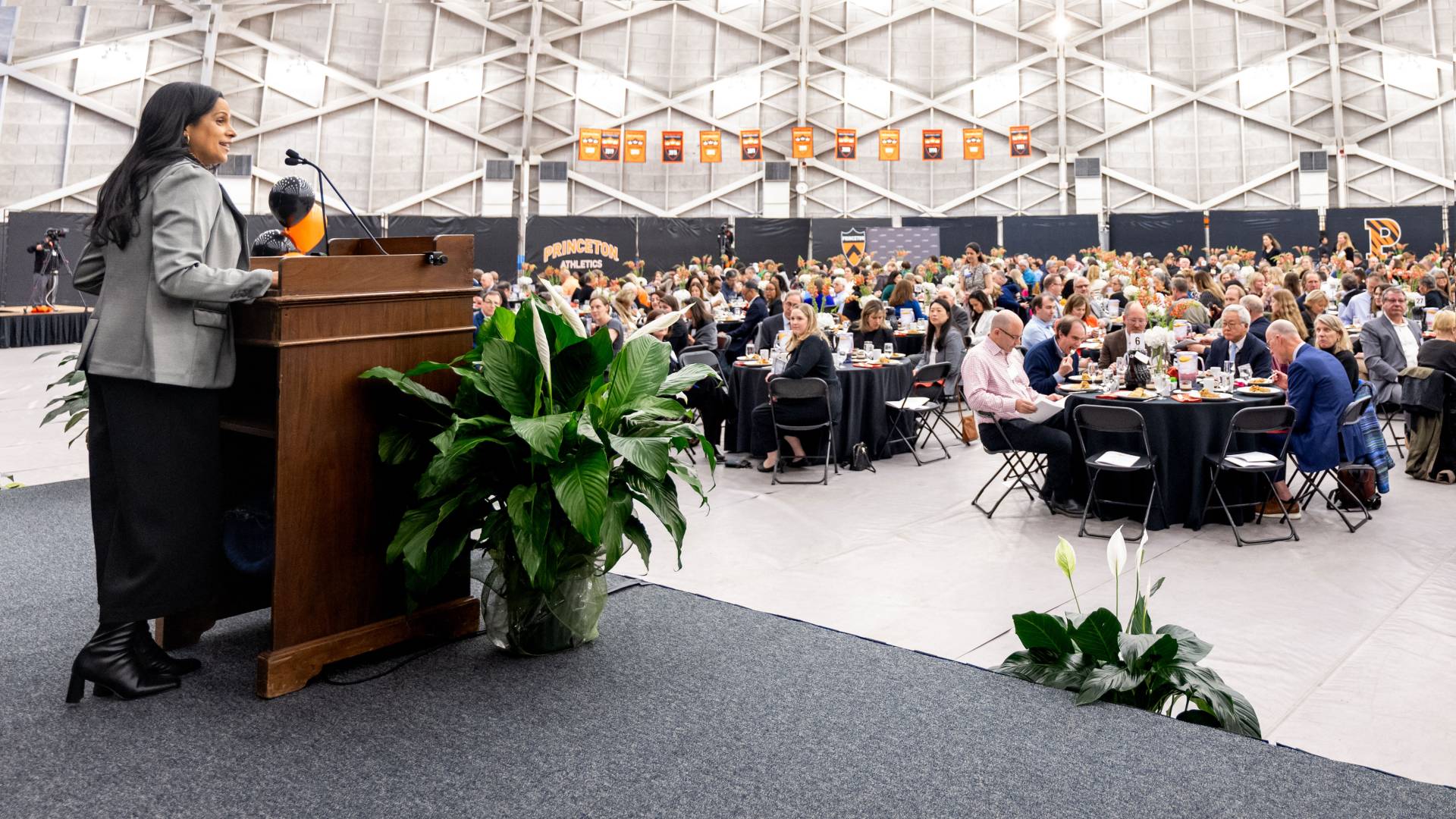 Romy Riddick at the podium, addressing the crowd at Jadwin