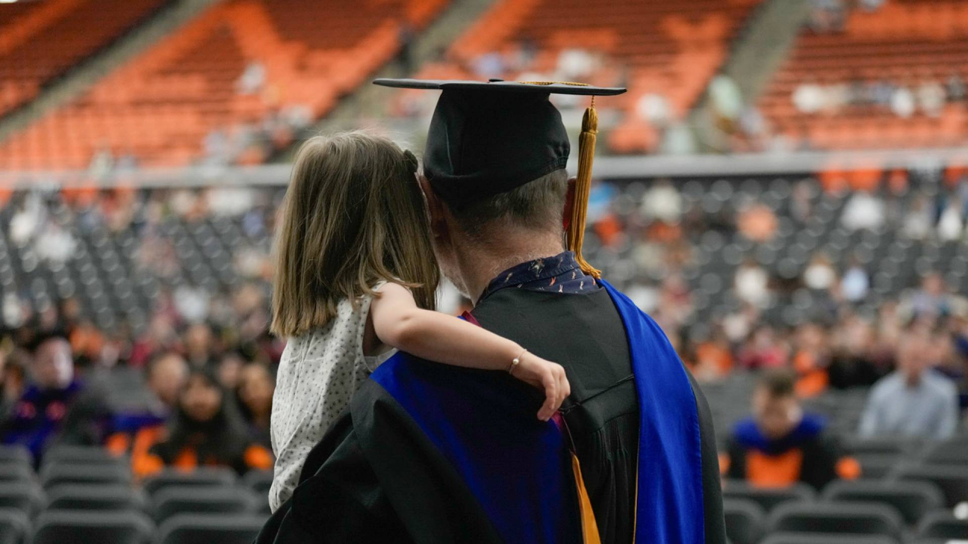 Several graduates chose to bring their children with them as they were honored by the Graduate School.