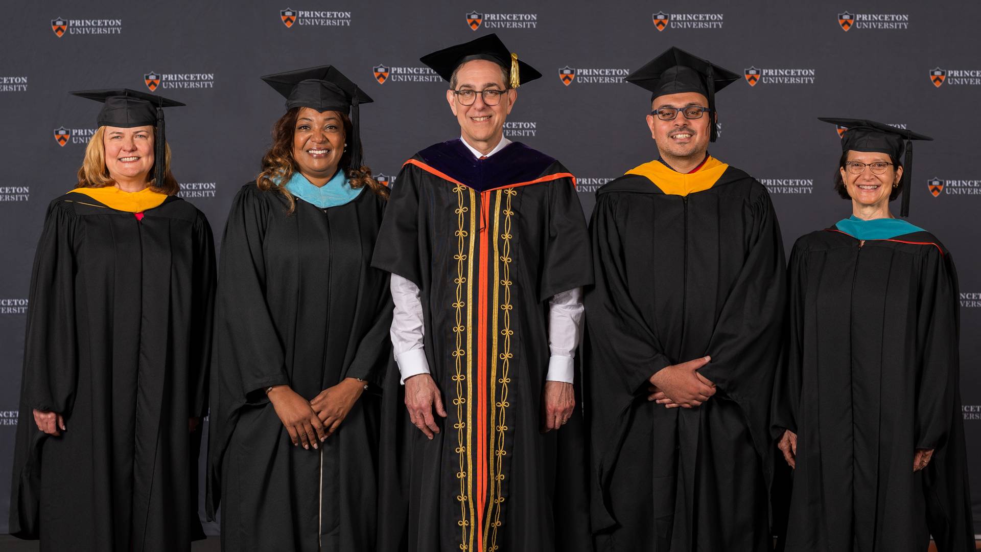 Four secondary teachers pose with Princeton University president Christopher L. Eisgruber '83