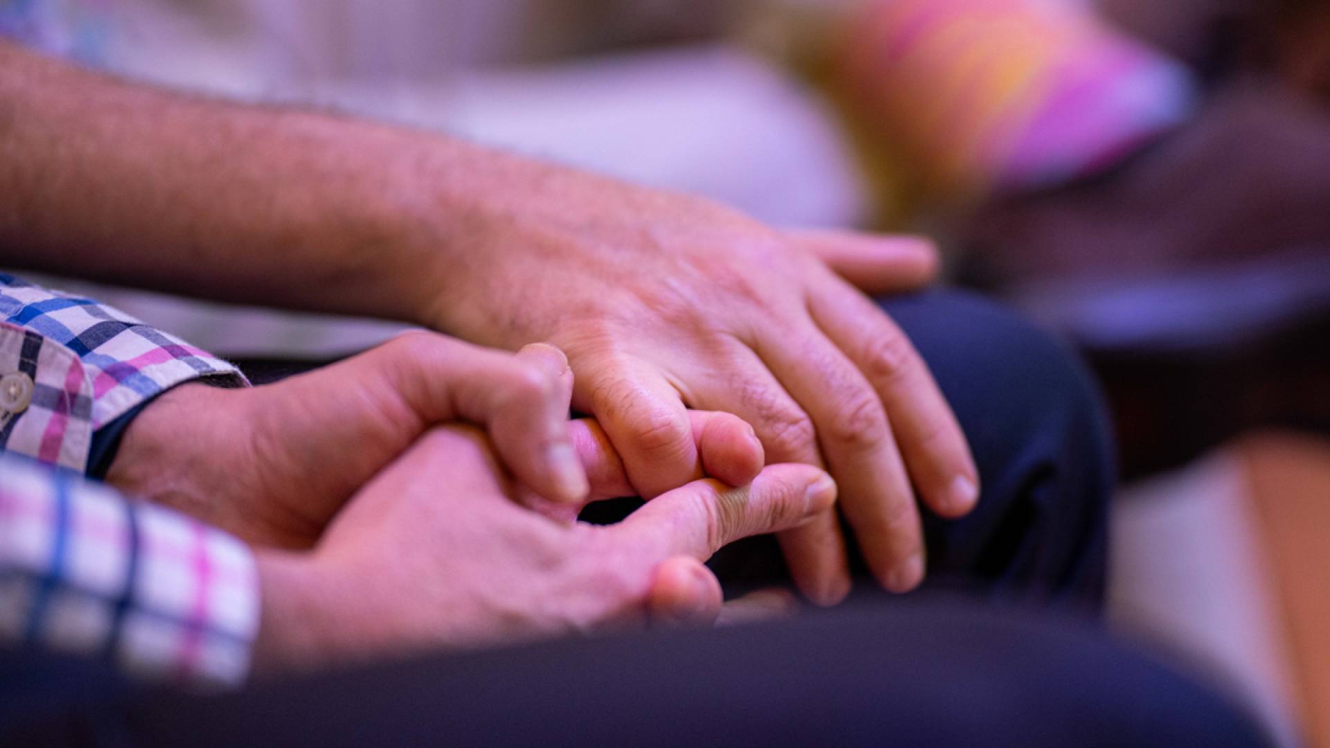 A close-up of holding hands