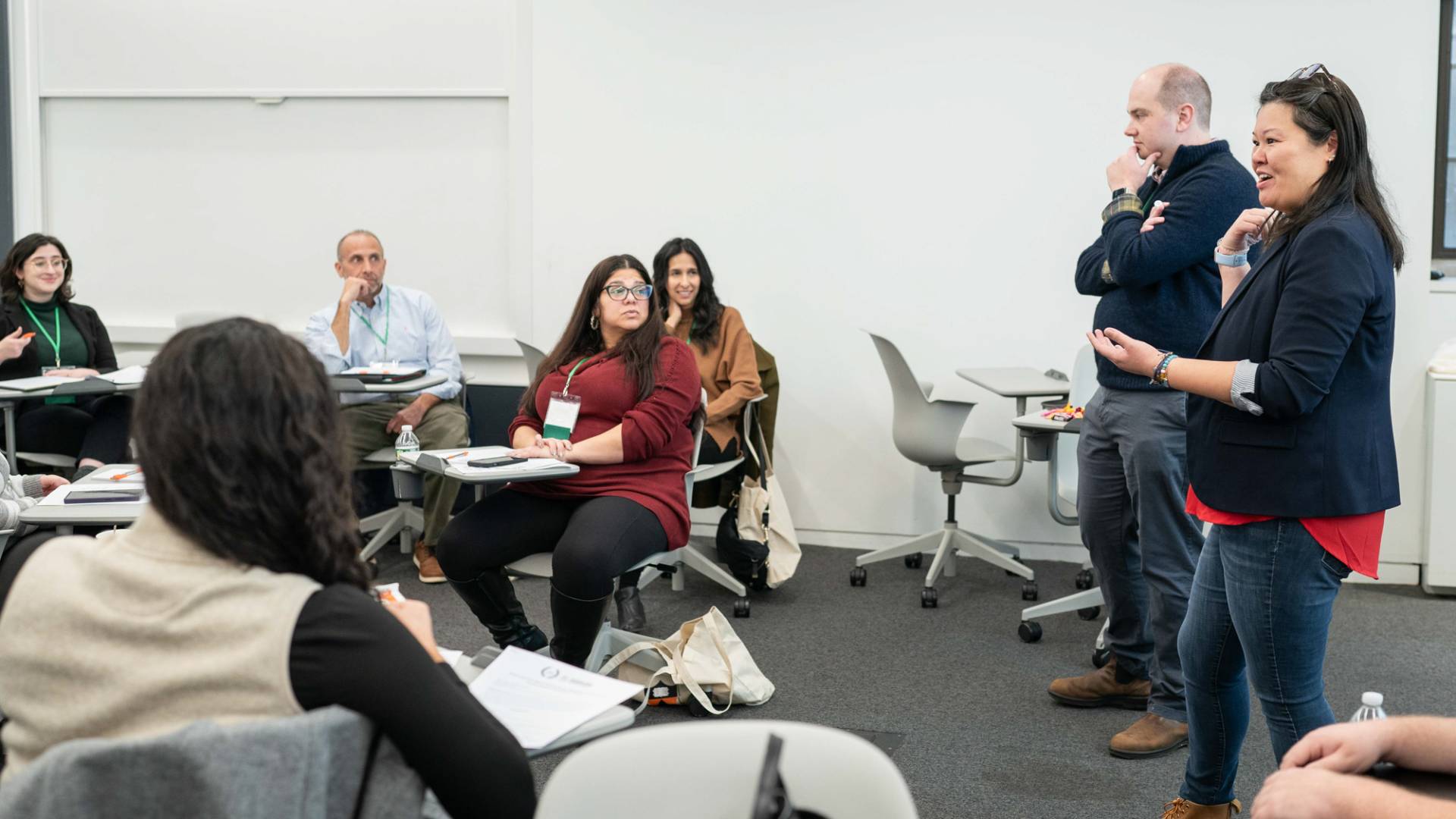 Group of people in a room in discussion.