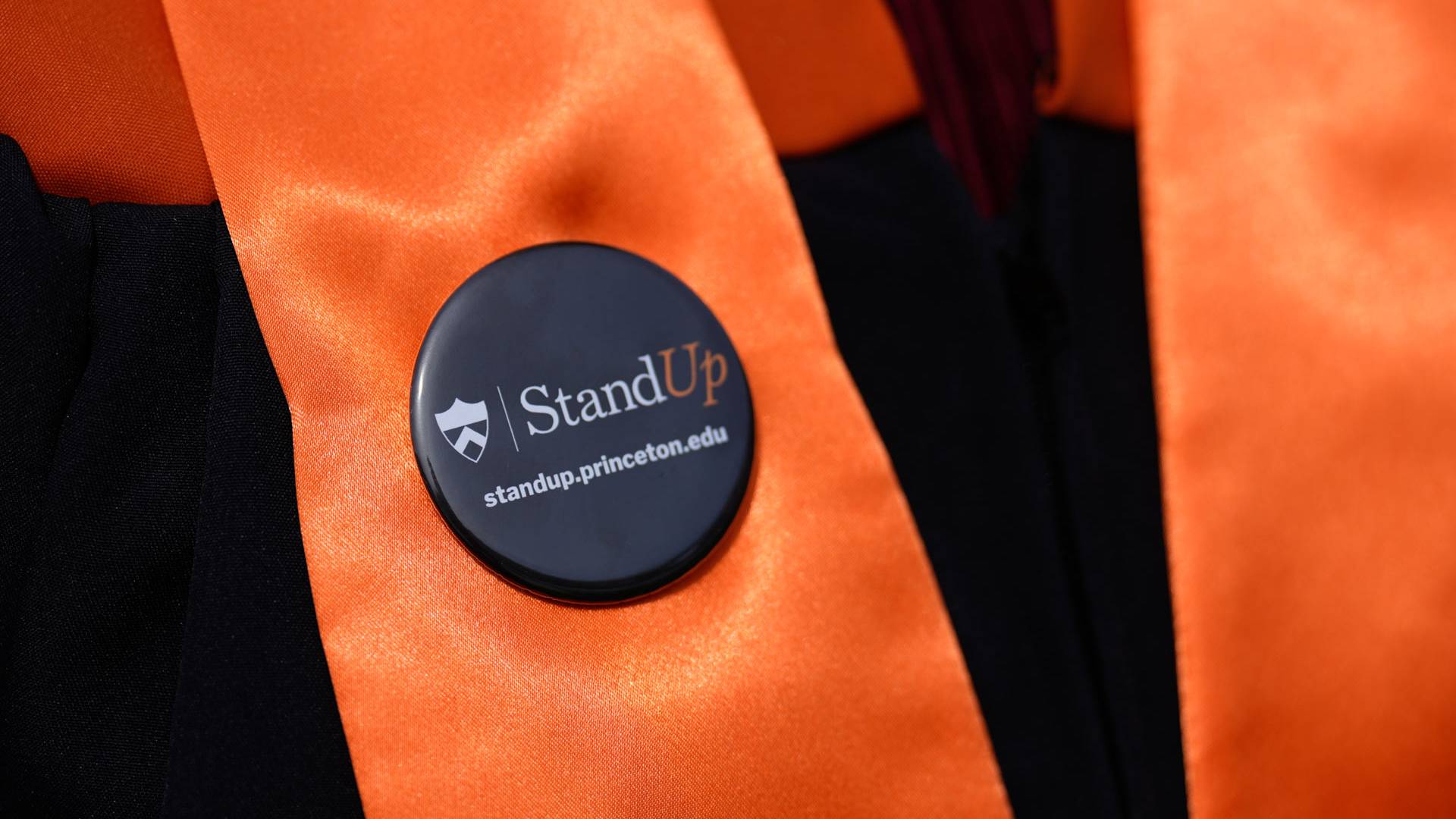 Close up of a Stand Up for Princeton button 