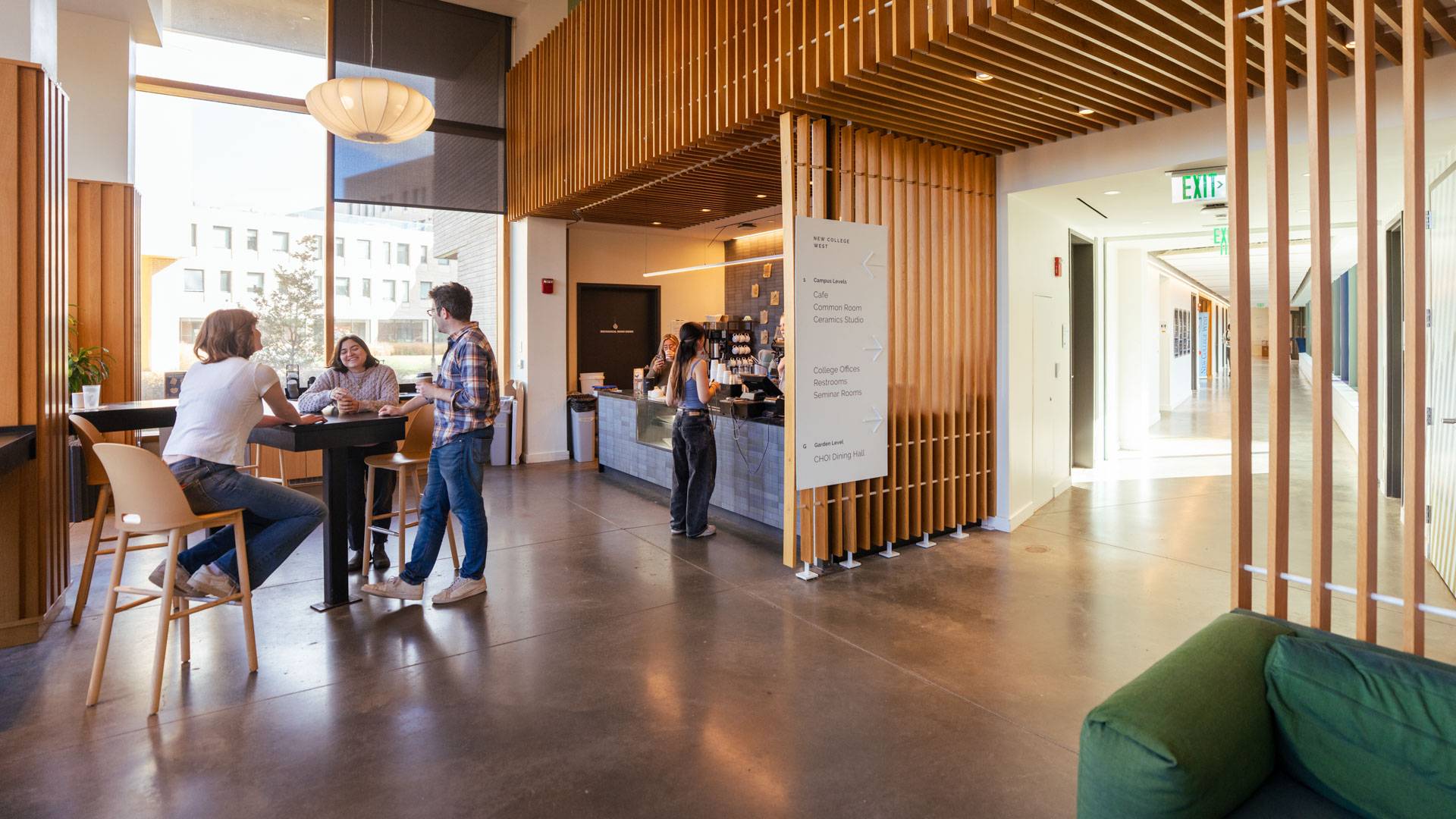 Students drink coffee at cafe tables 