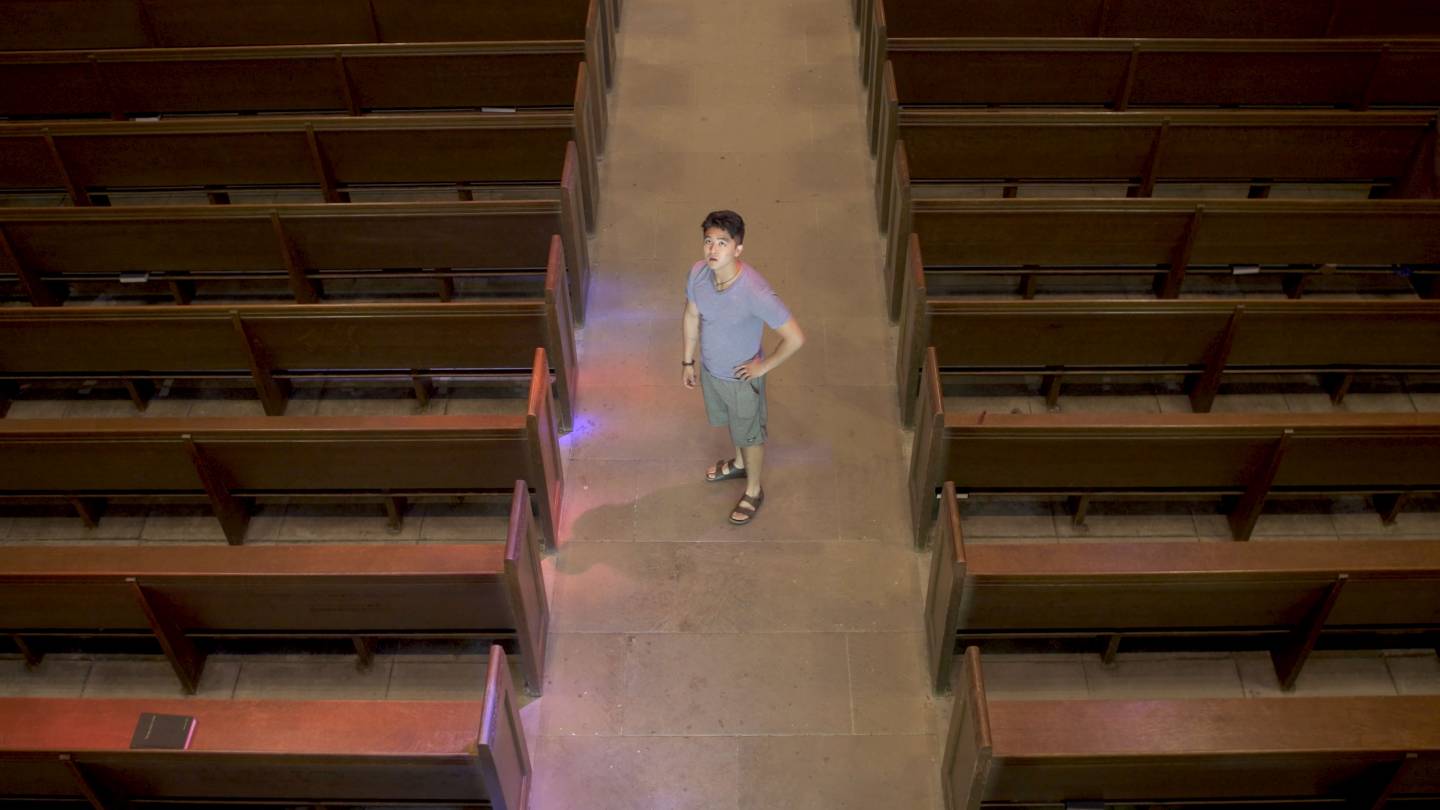 Christian Shin standing in chapel
