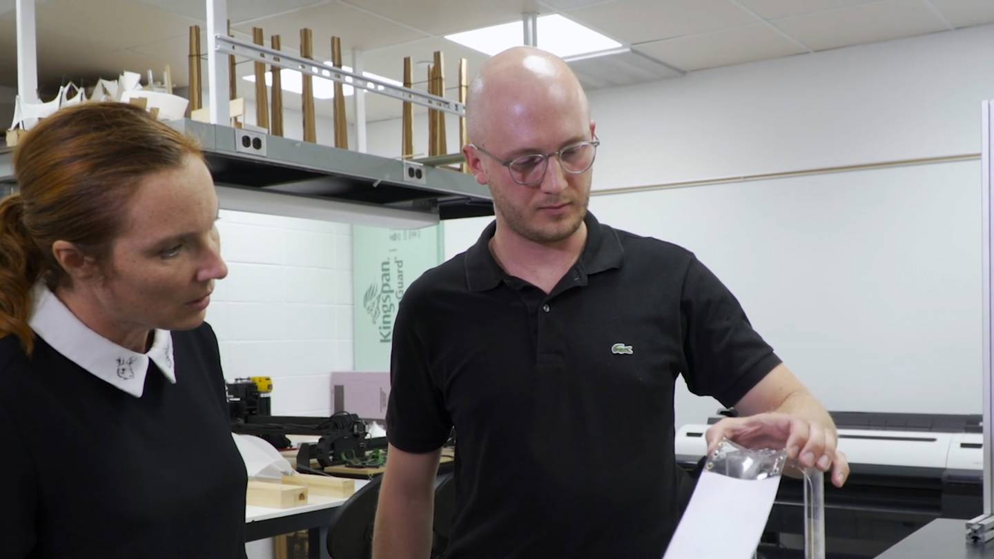 Sigrid Adriaenssens and Victor Charpentier look at a model