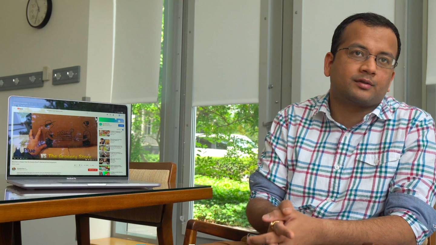 A graduate student while showing advertising on a laptop screen