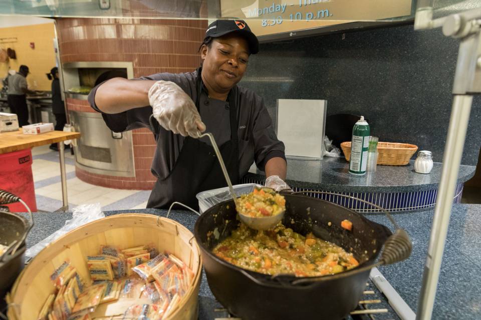 Ladling food into freezer bag