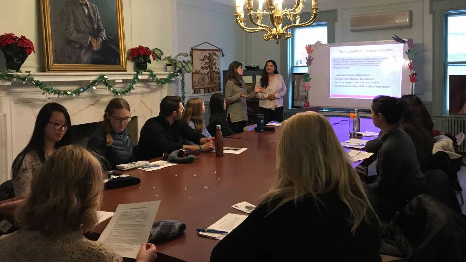 Professor Anna Stilz and students meeting at International Institute of Buffalo