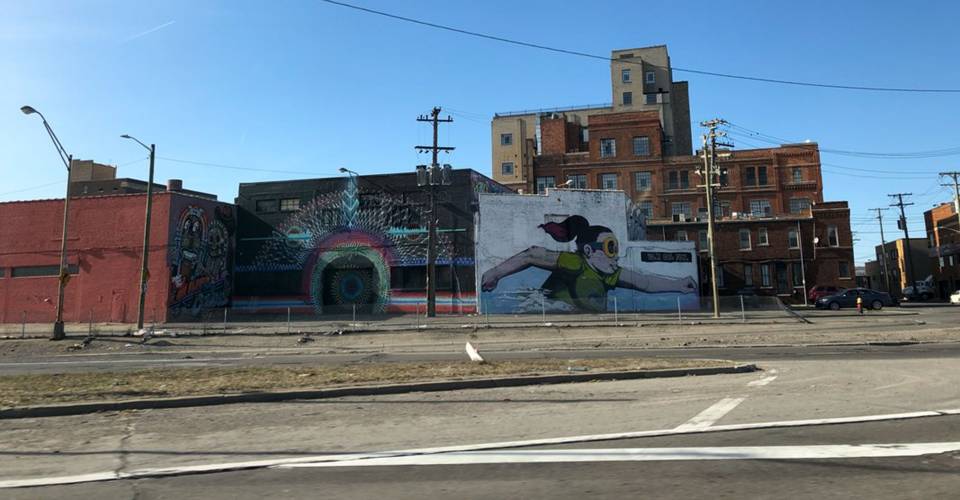 Mural of running girl on Detroit building