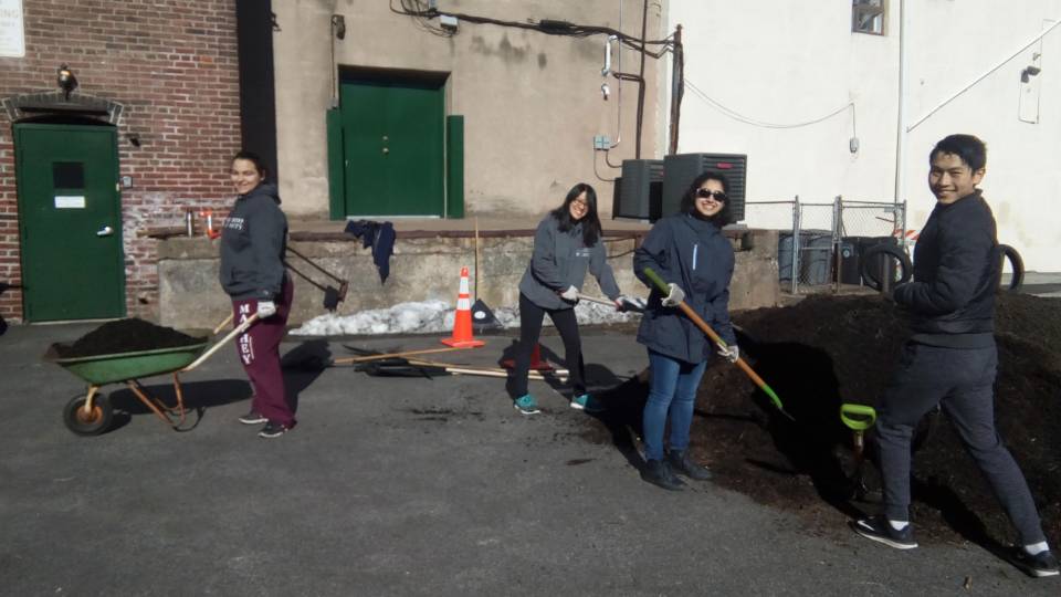 Students using wheelbarrow