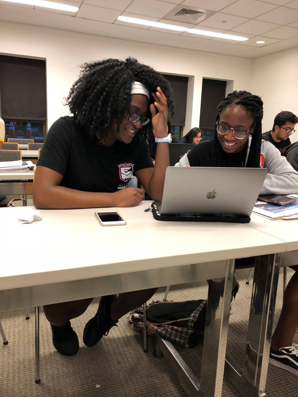 Fedjine Victor and Arianne Smith working on laptop