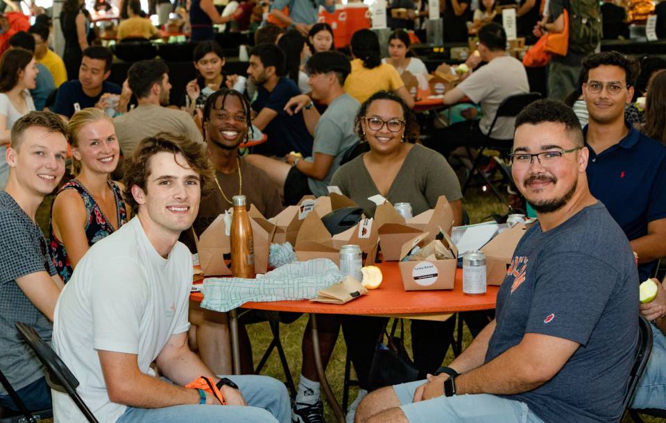 Graduate students at lunch during orientation