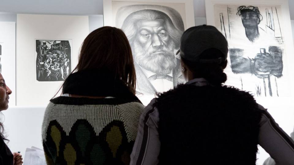 Students in "Enter the New Negro: Black Atlantic Aesthetics," taught by Anna Arabindan-Kesson, assistant professor of art and archaeology and African American studies (left), discuss original art works in a study room at the Princeton University Art Museum.