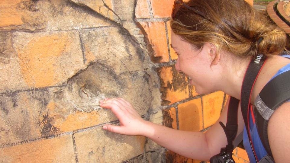 Isabella Douglas looking at reinforced concrete in Cuba