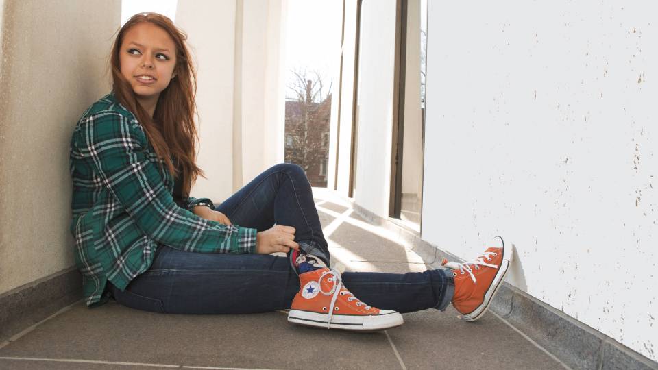 Peyton Lawrenz sitting outside Robertson Hall