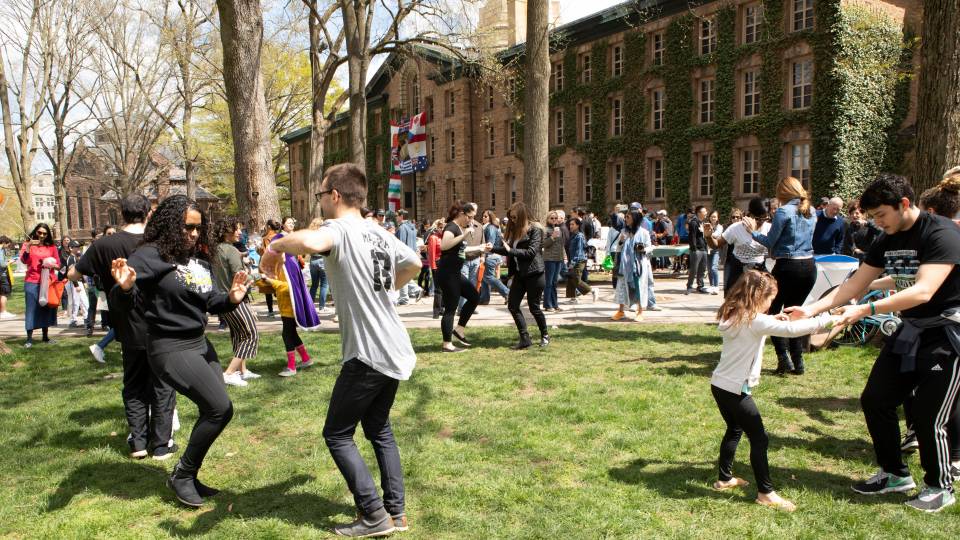 Mas Flow dance group leading dancers on Nassau Hall front lawn