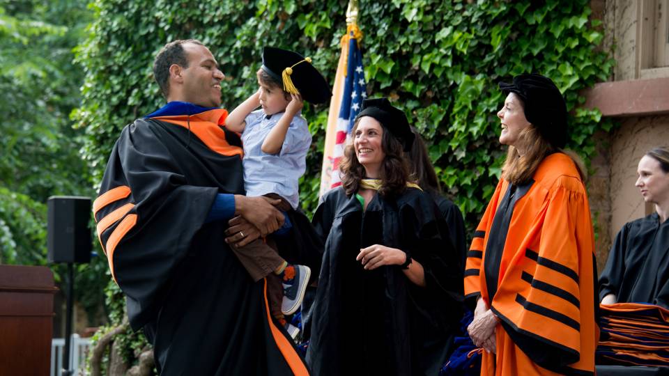 Brahim El Guabli receiving hood with his son