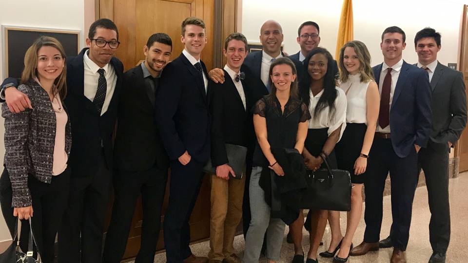 Policy taskforce poses with Senator Cory Booker