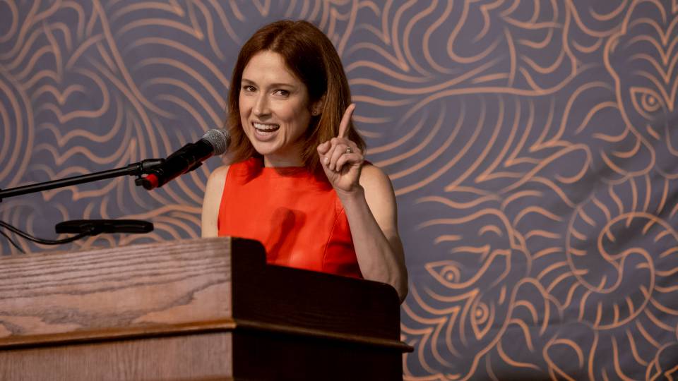 Ellie Kemper speaking at podium